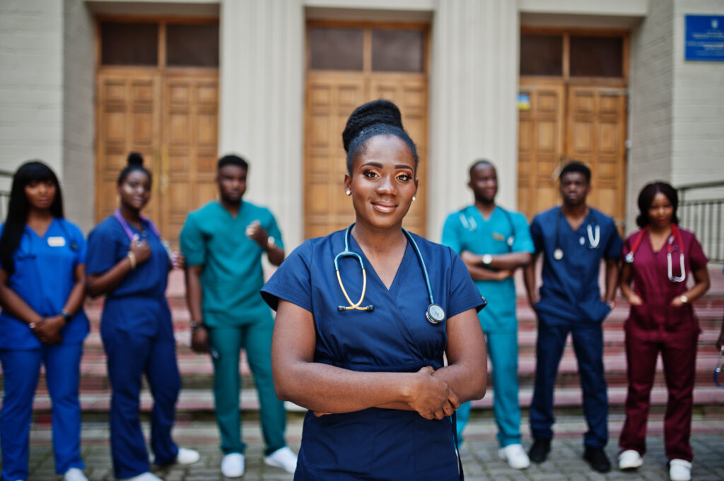 group of african medical students posed outdoor against universi